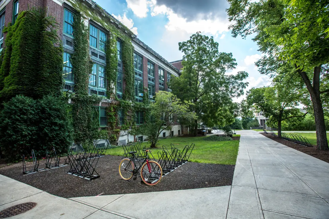 Photograph of Facilities Management Company's Brick Building and Green Space with a bike