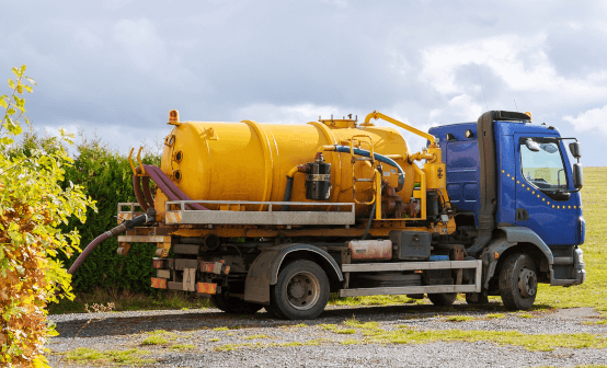 photograph of septic tanker in a field